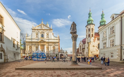 Wawel Cathedral exterior with tourists in Krakow, Poland.