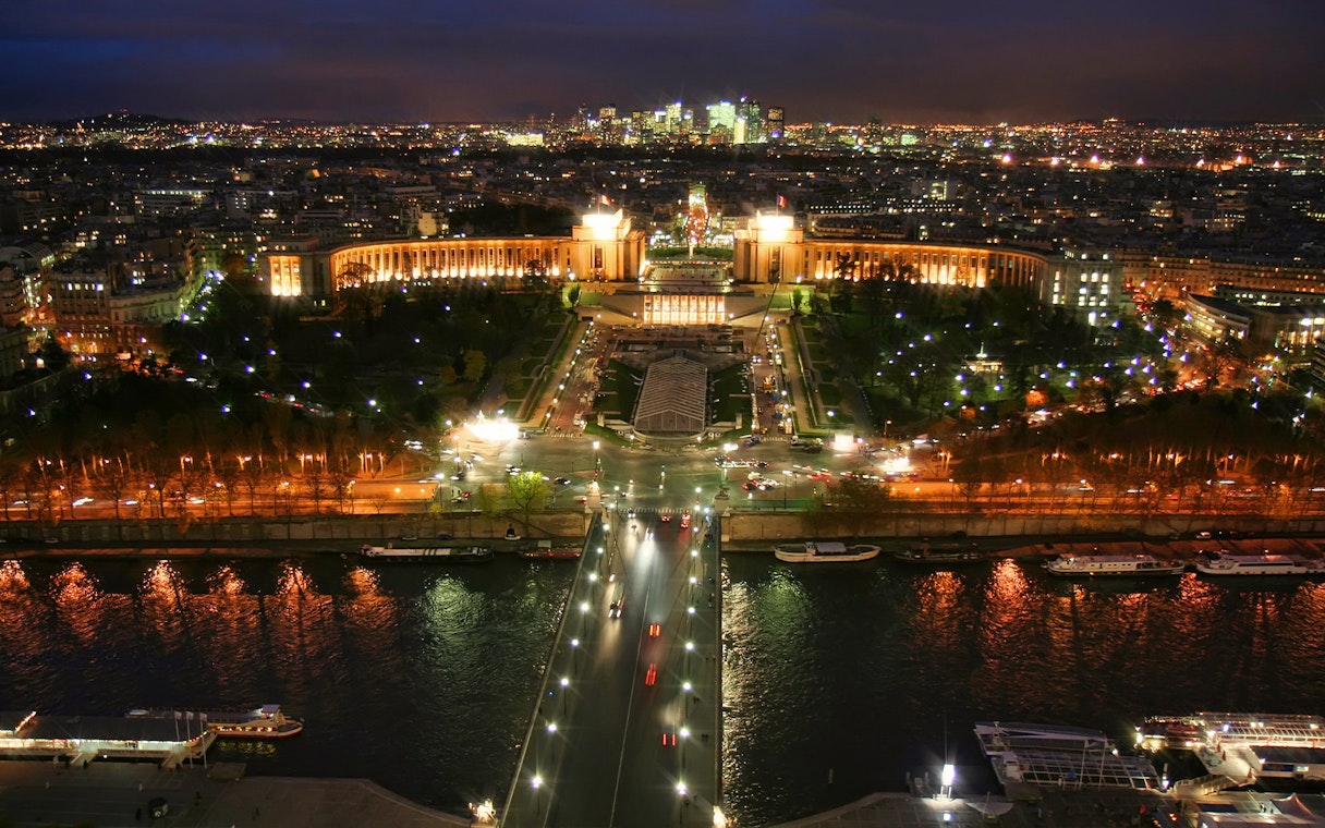 View of Trocadéro Gardens and Seine River at night from Eiffel Tower, Paris.