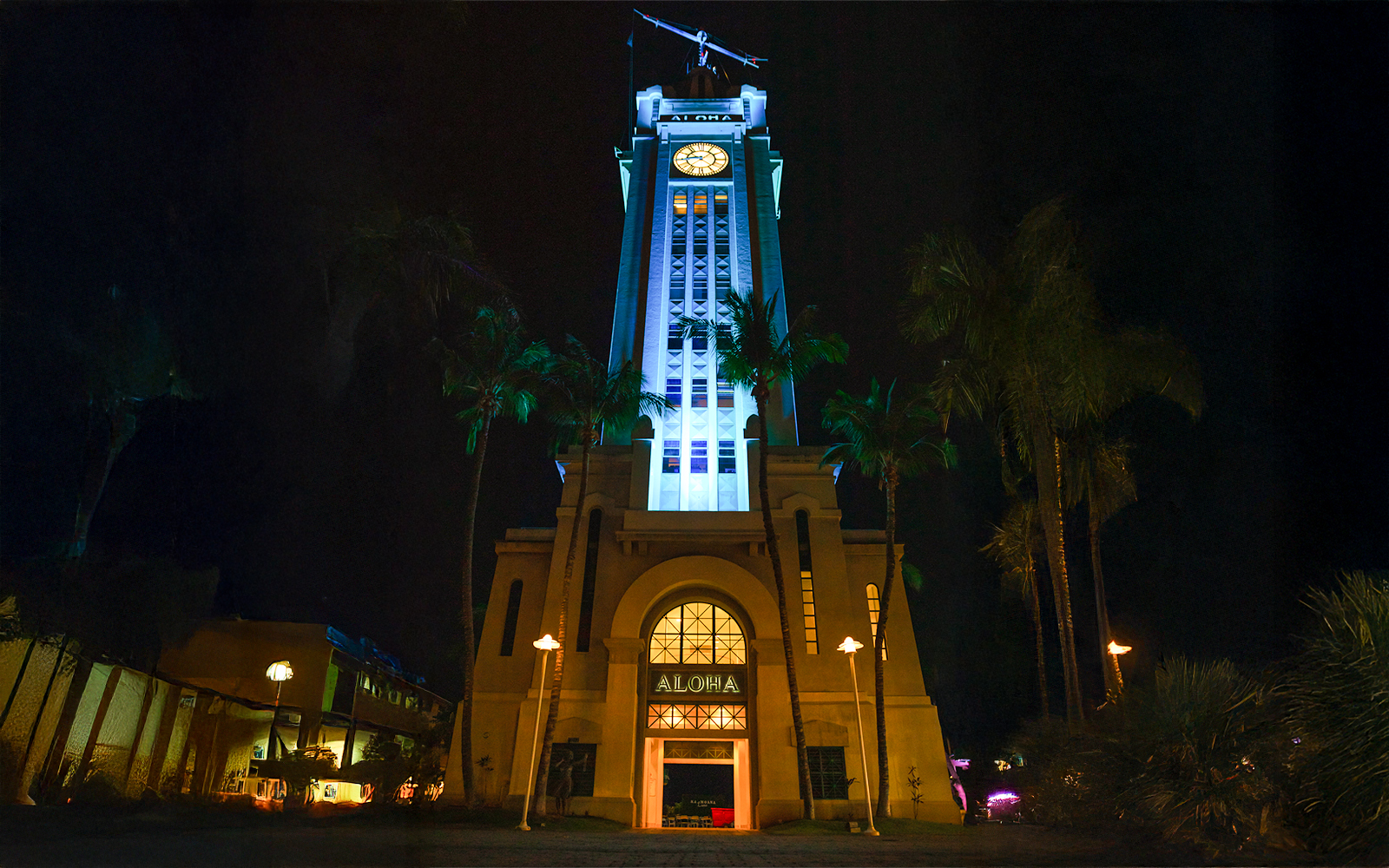 Aloha Tower illuminated at night, Moana Luau, Hawaii.