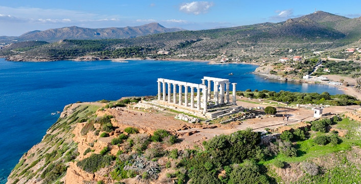Aerial view of the Temple of Poseidon at Cape Sounio, Greece, overlooking the Aegean Sea.