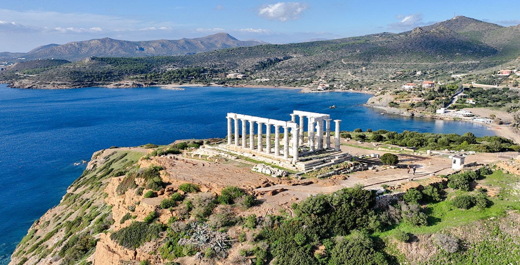 Aerial view of the Temple of Poseidon at Cape Sounio, Greece, overlooking the Aegean Sea.