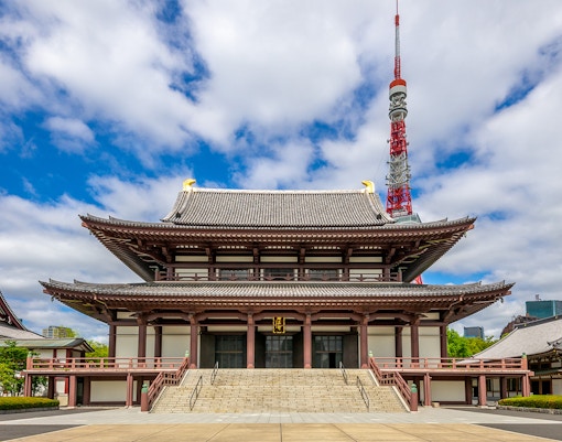 Main hall of Zojoji Temple with Tokyo Tower in the background.