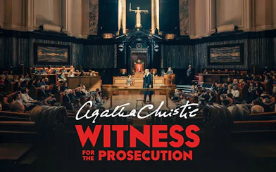 Courtroom scene from "Witness for the Prosecution" play with audience and judge.