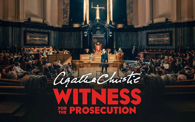 Courtroom scene from "Witness for the Prosecution" play with audience and judge.