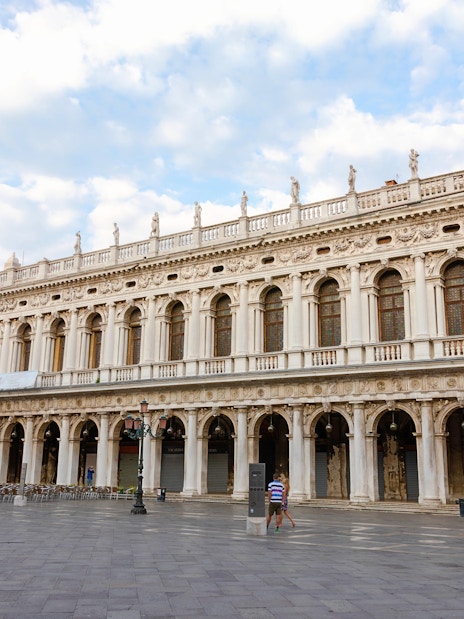 Panoramic view of Museo Correr facade in Venice, showcasing neoclassical architecture.
