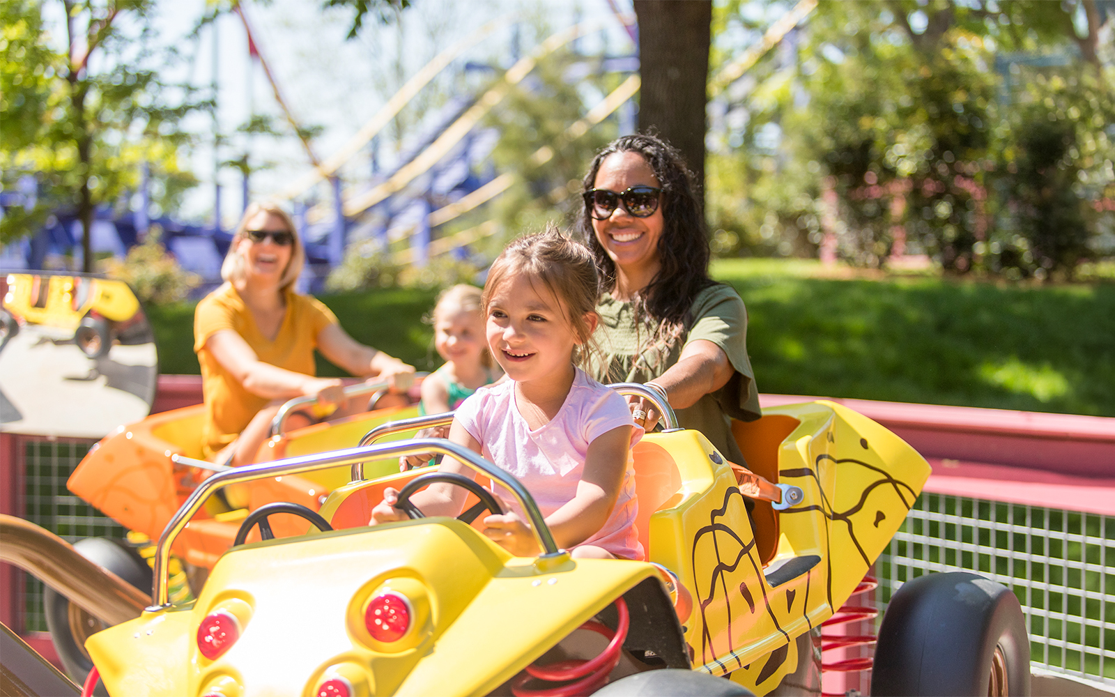 Children enjoying PIG PEN'S® Mud Buggies ride at Six Flags Carowinds.