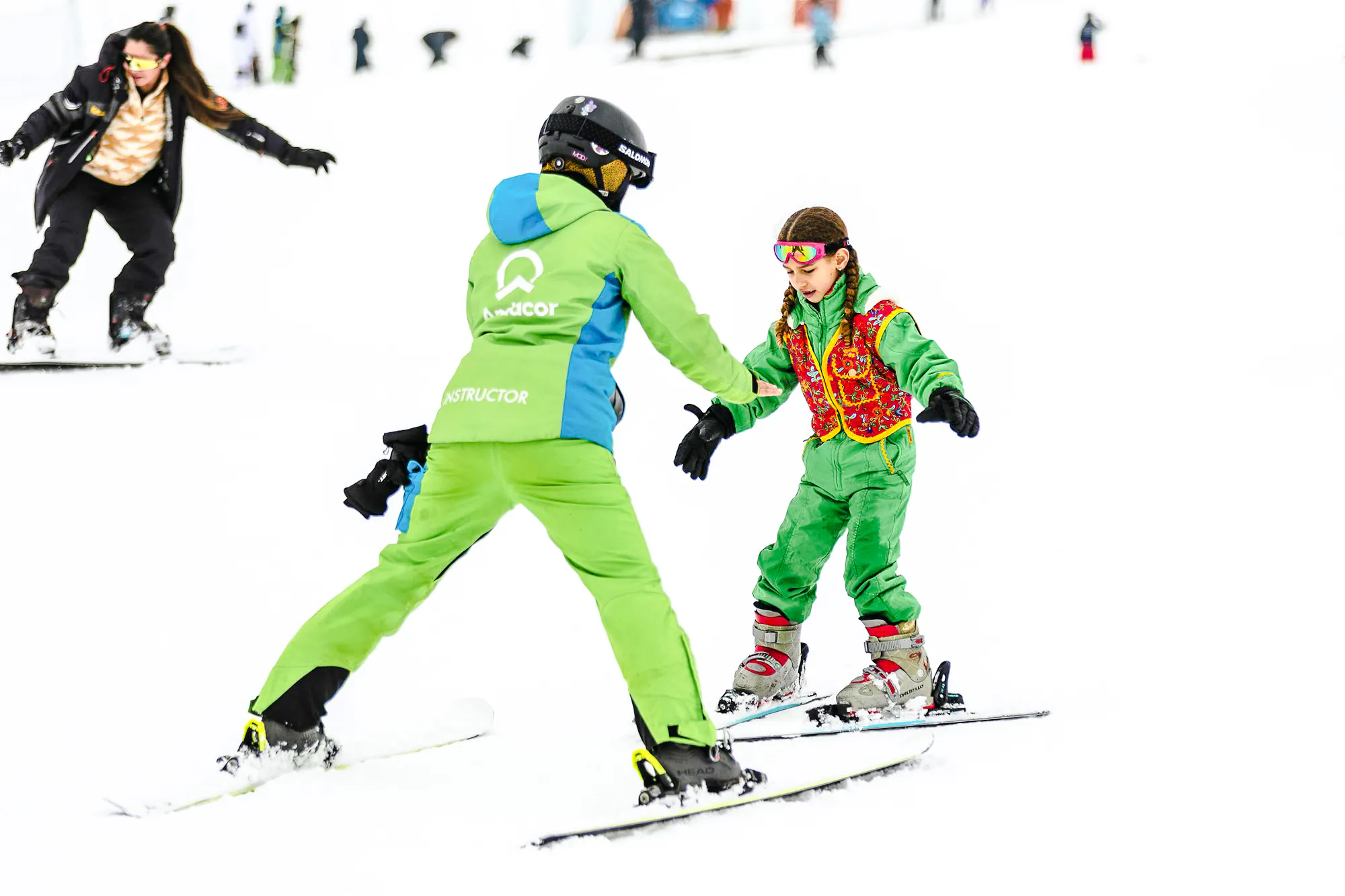 Child learning to ski with instructor at Farellones Ski, Santiago.