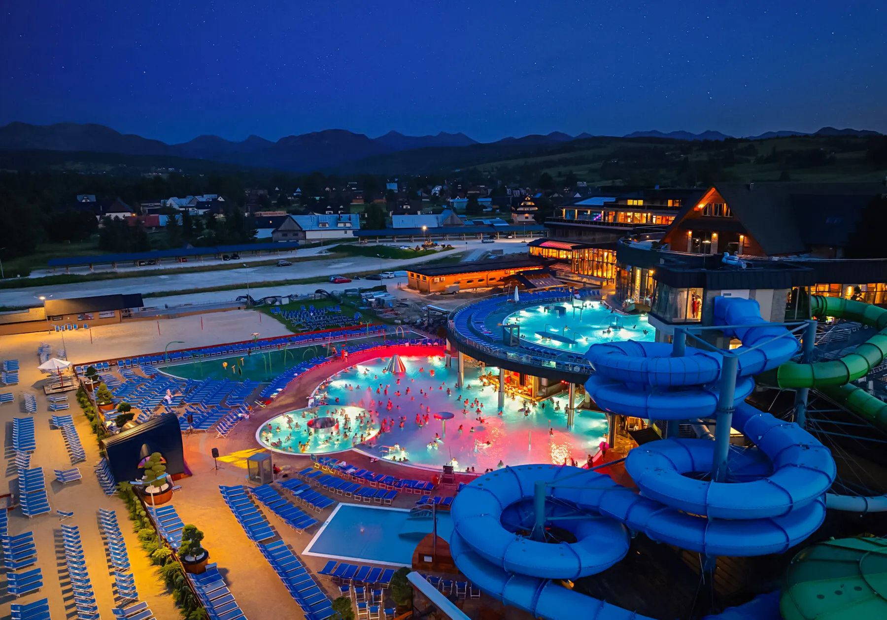 Zakopane hot springs and water park at night, view from Krakow day trip.