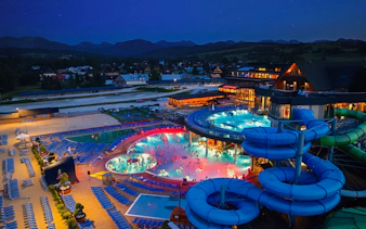 Zakopane hot springs and water park at night, view from Krakow day trip.