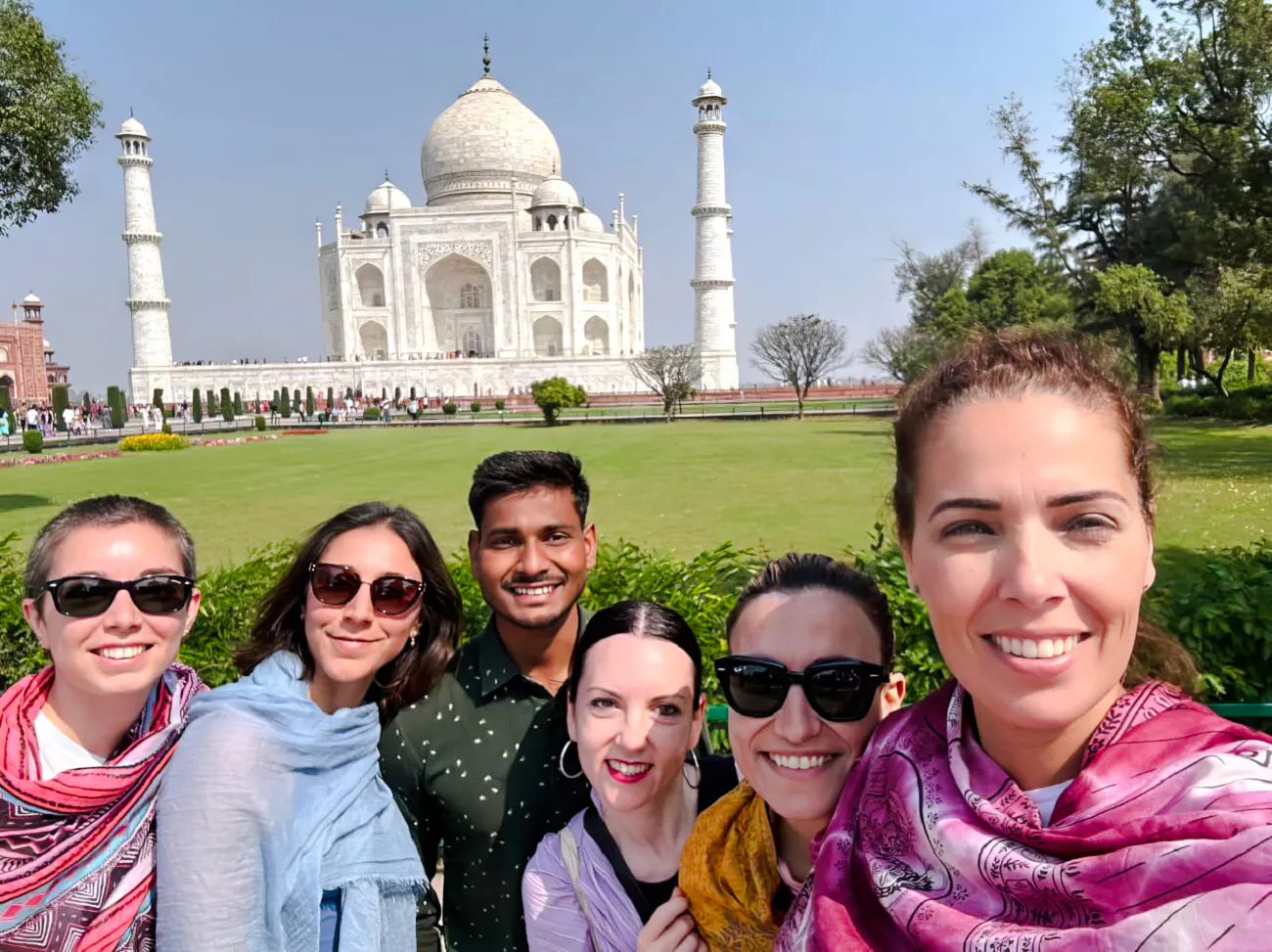 Group of tourists in front of the Taj Mahal, Agra, during a tour.