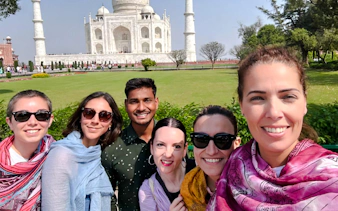 Group of tourists in front of the Taj Mahal, Agra, during a tour.