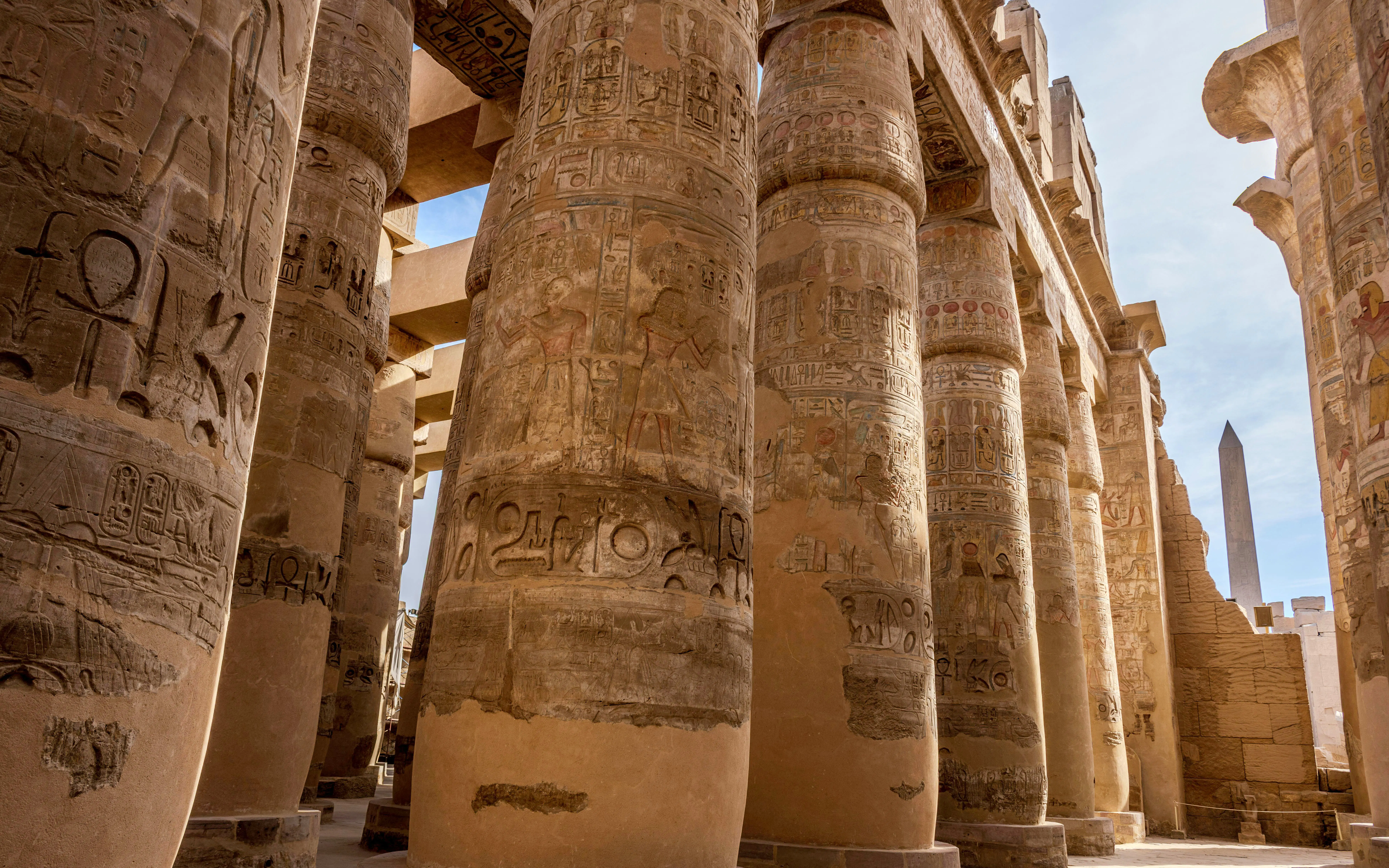 Ancient columns with hieroglyphs in the Great Hypostyle Hall, Karnak Temple, Luxor, Egypt.