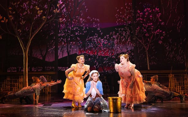 Stage scene from "Once Upon a One More Time" musical with performers in fairy tale costumes.