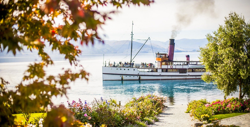 TSS Earnslaw steamboat approaching Walter Peak High Country Farm on Lake Wakatipu
