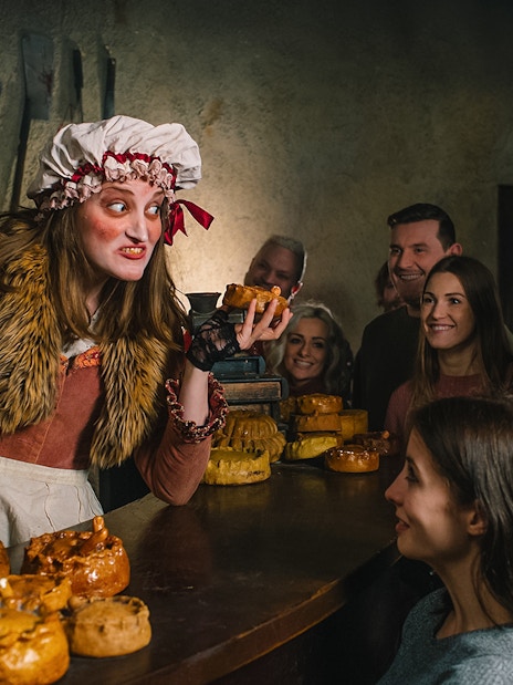 Mrs Lovett serving pies to visitors at London Dungeon's pie shop.
