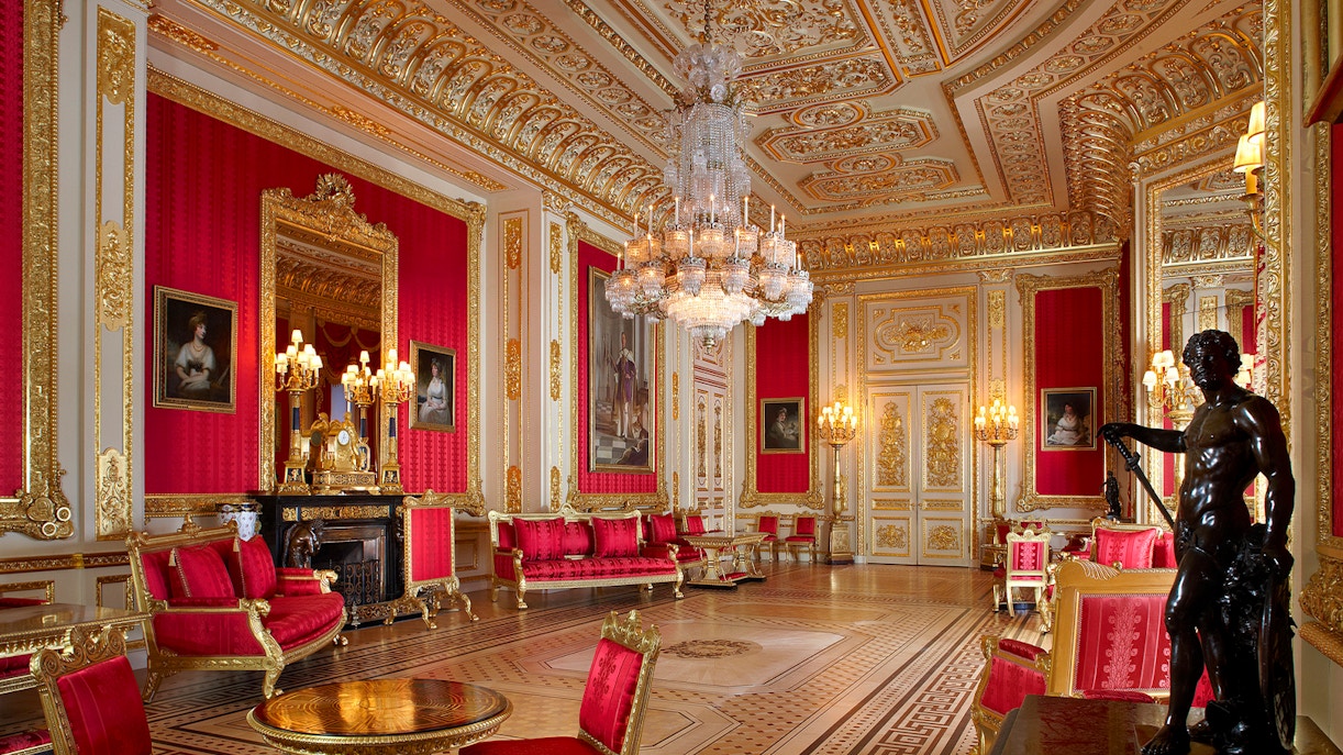 Crimson Drawing Room with ornate gold decor and chandeliers, Windsor Castle.