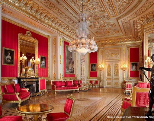 Crimson Drawing Room with ornate gold decor and chandeliers, Windsor Castle.