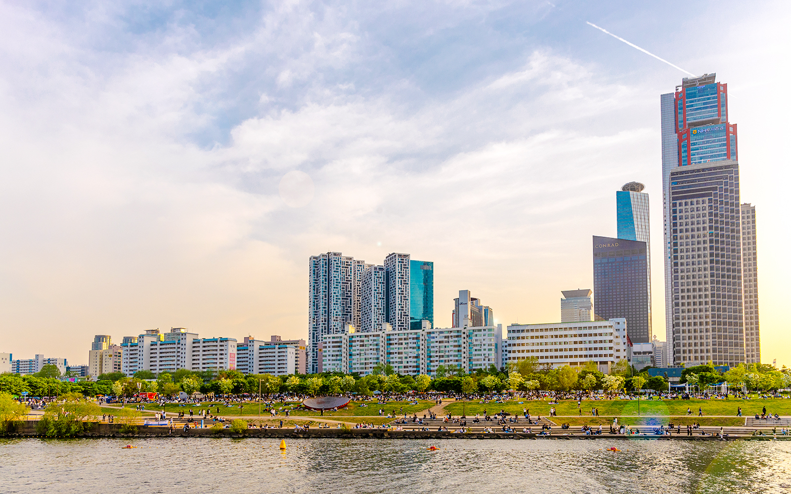 Hangang River view with skyscrapers and park, Eland Cruise, Seoul.
