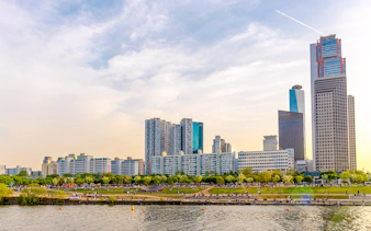 Hangang River view with skyscrapers and park, Eland Cruise, Seoul.