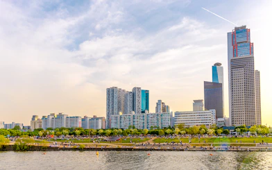 Hangang River view with skyscrapers and park, Eland Cruise, Seoul.