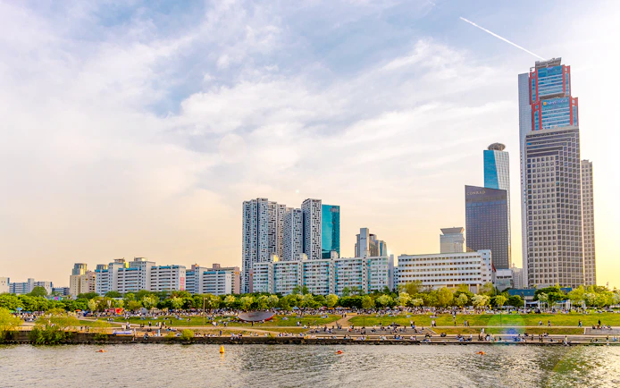 Hangang River view with skyscrapers and park, Eland Cruise, Seoul.