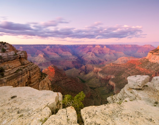 Hikers exploring red sandstone formations at Valley of Fire State Park, Nevada.