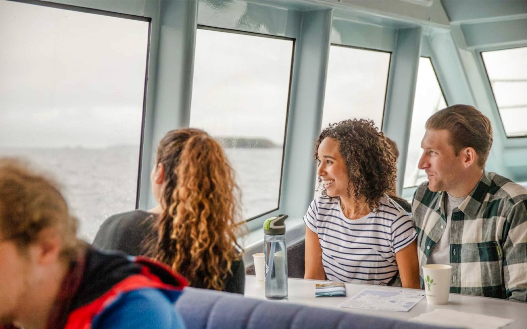 Passengers enjoying the view from Stewart Island Ferry window.