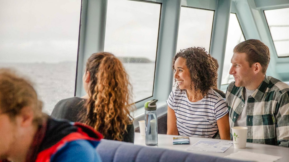 Passengers enjoying the view from Stewart Island Ferry window.