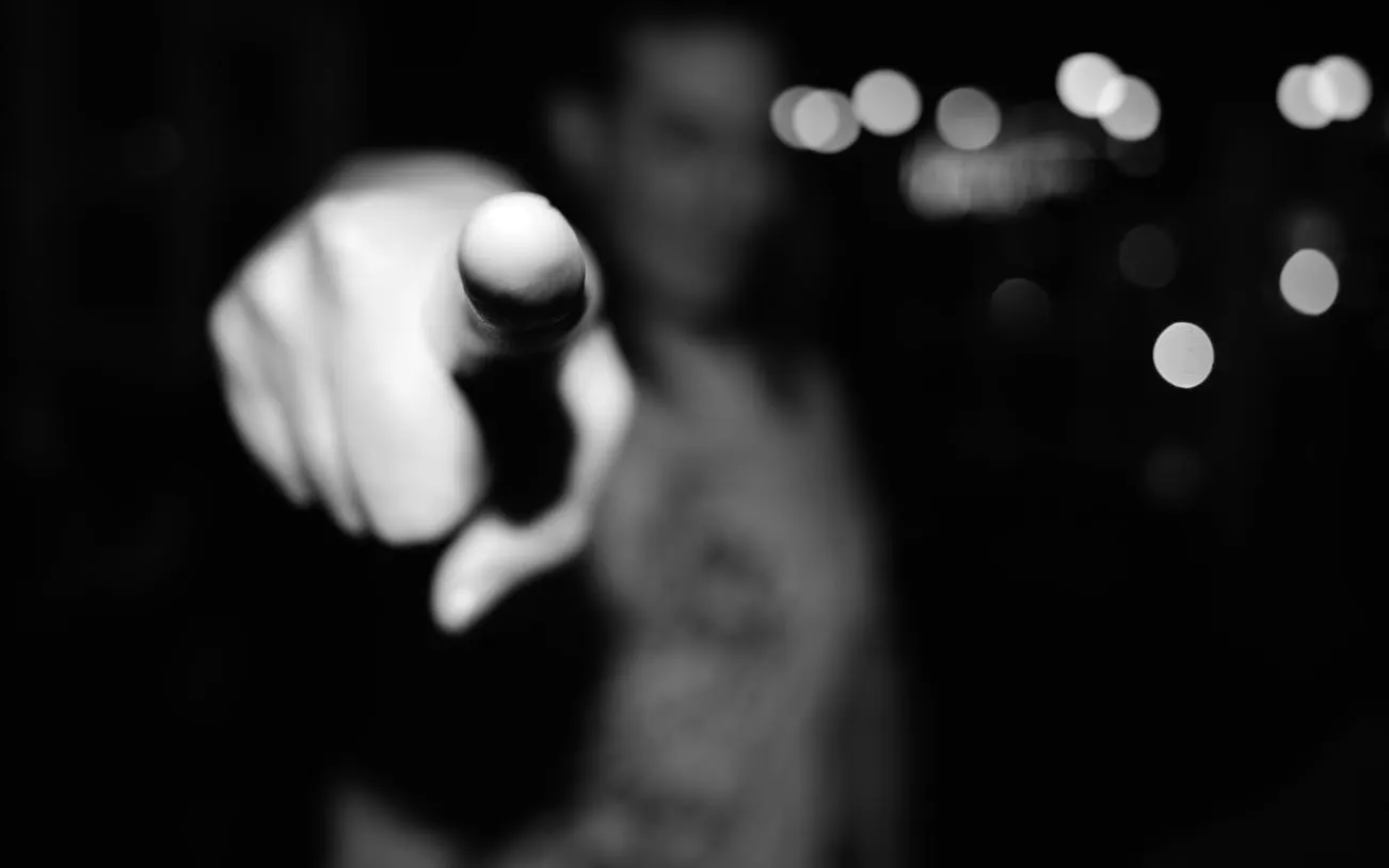 Pointing finger in focus, representing Reykjavík Icelandic punk tour experience.