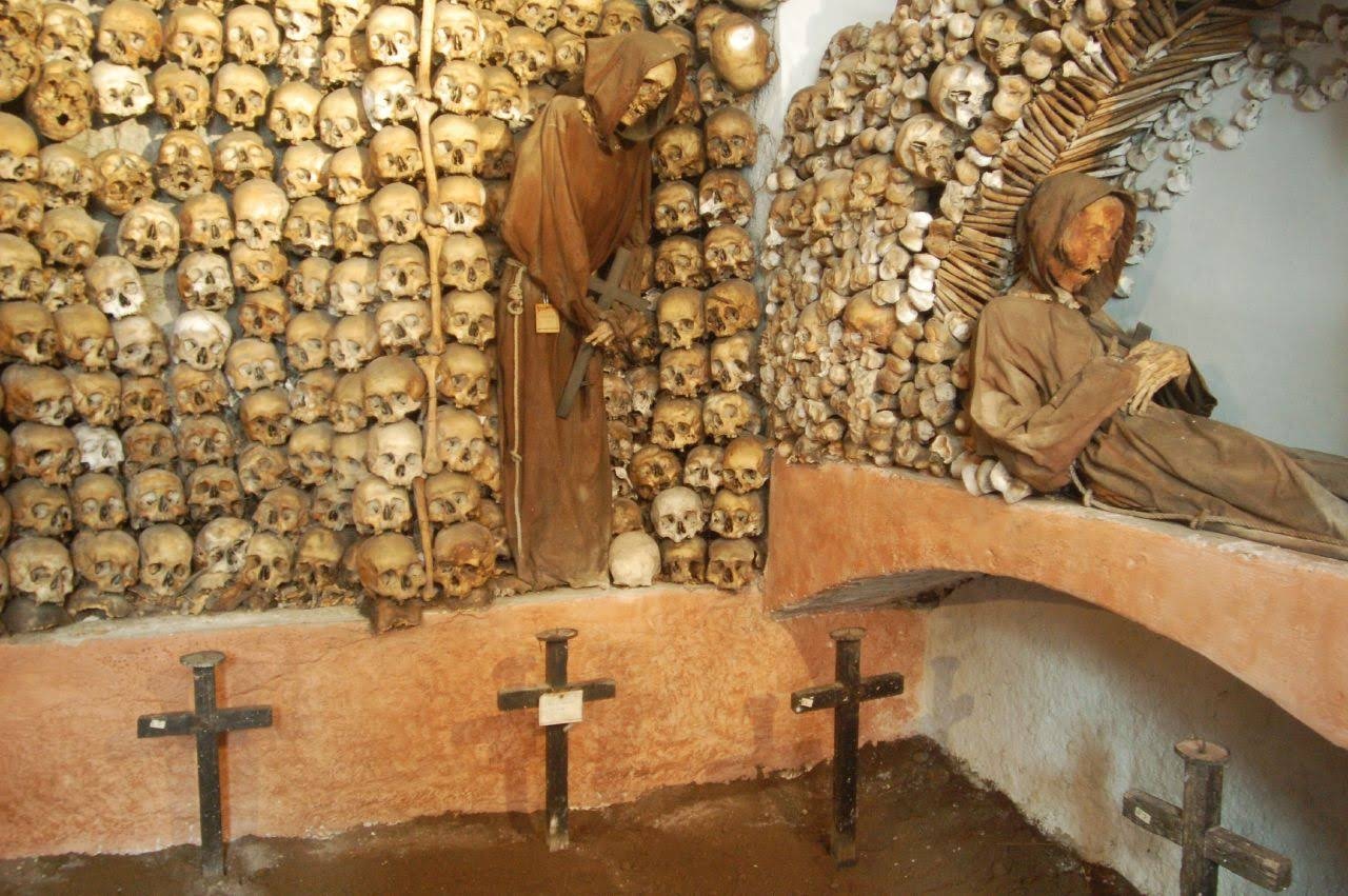 Roman Catacombs Capuchin Crypt with skulls and monk figures in Rome, Italy.