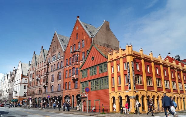 Colorful historic buildings in Bergen, Norway, along the sightseeing cruise route.