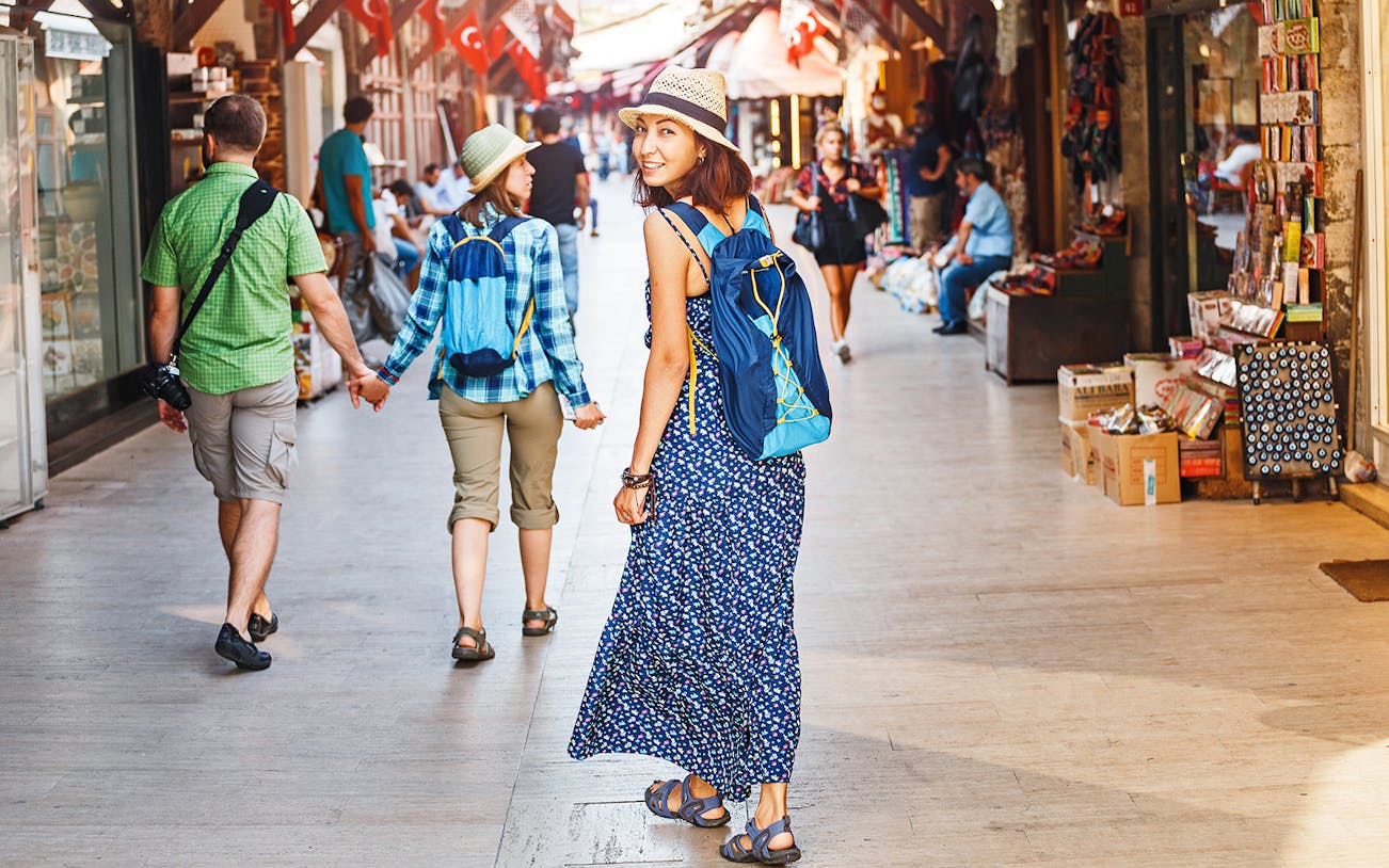 Tourists walking through a bustling Istanbul market en route to Hagia Sophia.