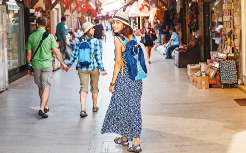 Tourists walking through a bustling Istanbul market en route to Hagia Sophia.