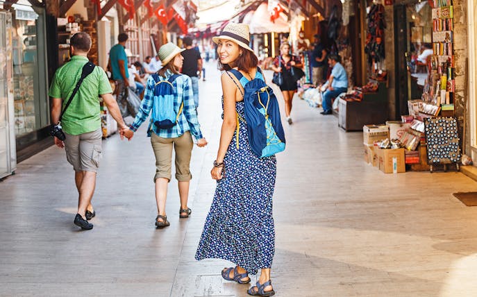 Tourists walking through a bustling Istanbul market en route to Hagia Sophia.