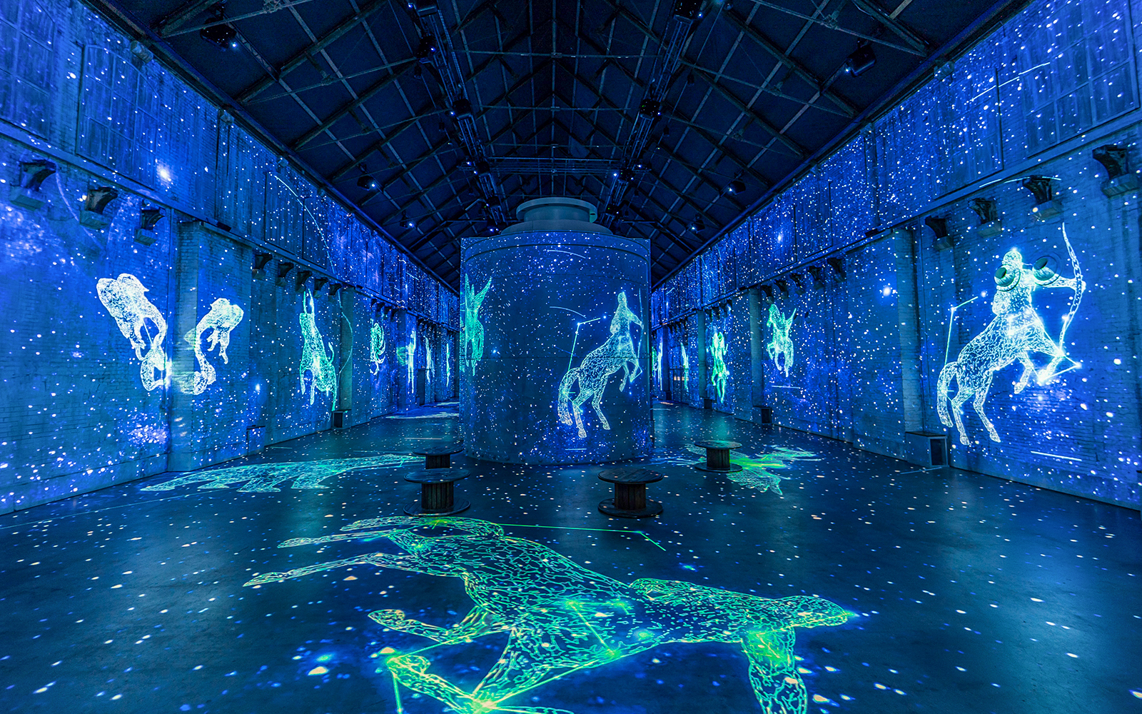 Digital constellations projected in Fabrique des Lumières' immersive cosmos exhibit.