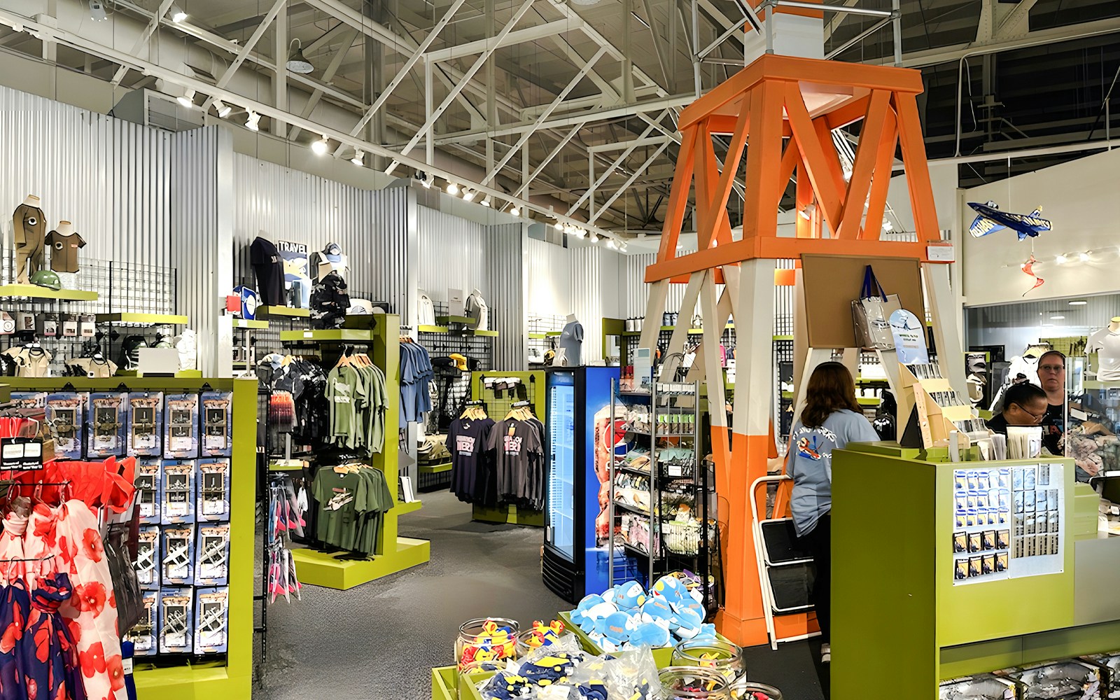 Gift shop interior at Pearl Harbor Aviation Museum with apparel and souvenirs.