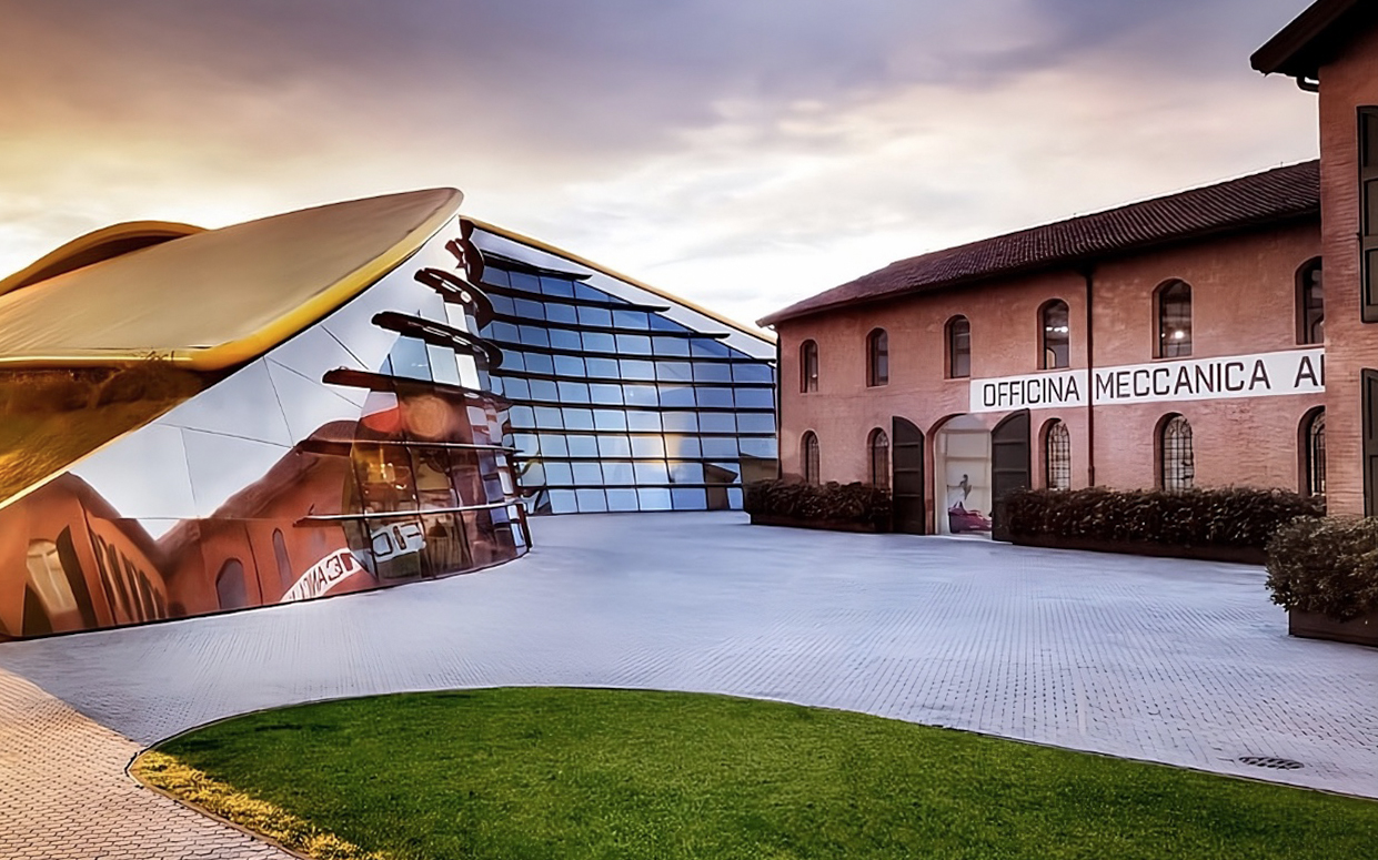 Enzo Ferrari House Museum entrance with modern glass facade and historic brick building.