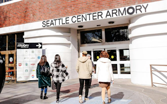 Visitors entering Seattle Center Armory for food tour.