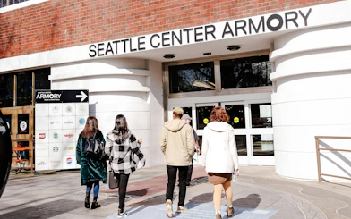Visitors entering Seattle Center Armory for food tour.