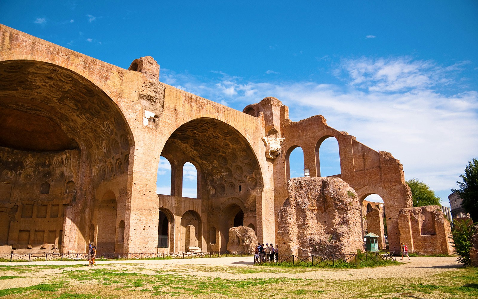 Basilica of Maxentius ruins in Rome with ancient arches and columns.