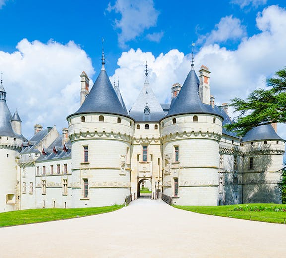 Château de Chaumont in Loire Valley, France, with its iconic turrets and stone facade.