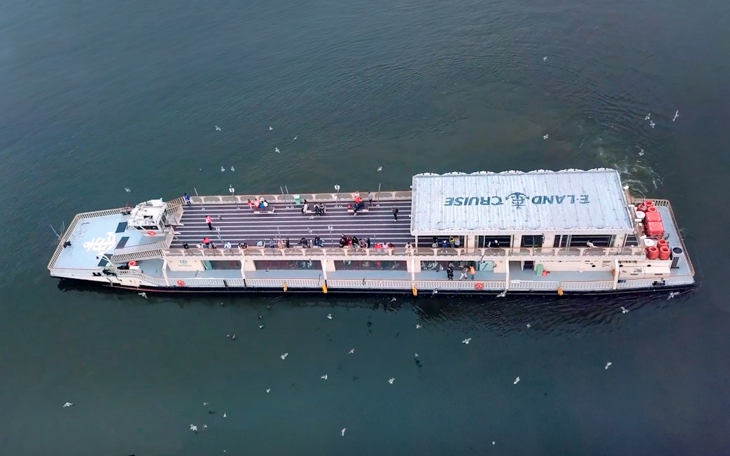 E-land ferry cruise on Han River in Seoul with passengers on deck.