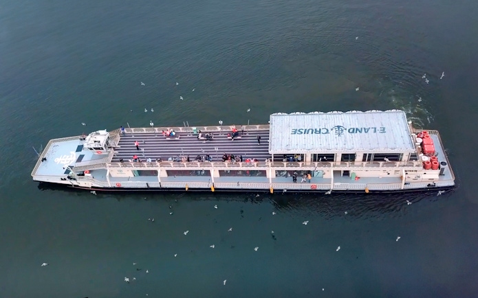E-land ferry cruise on Han River in Seoul with passengers on deck.