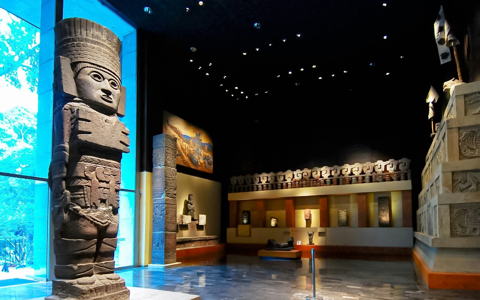 Visitors exploring exhibits at the Anthropology Museum in Mexico City.