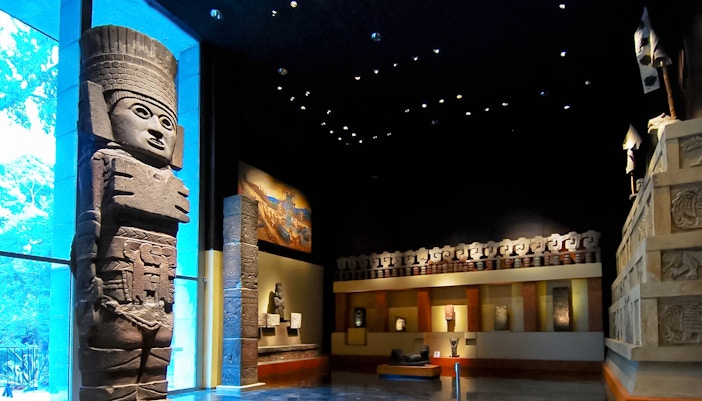 Visitors exploring exhibits at the Anthropology Museum in Mexico City.