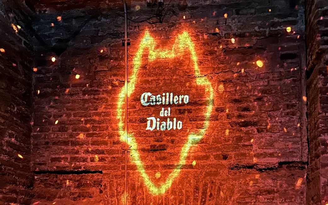 Casillero del Diablo logo projected on a brick wall.