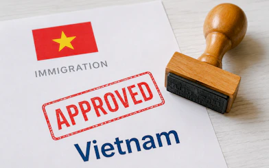 Vietnam immigration document with approved stamp and flag, related to E-visa service in Hanoi.