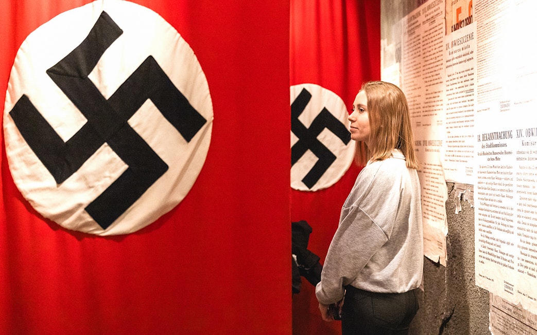 Nazi flag display inside Oskar Schindler's Factory museum exhibit.