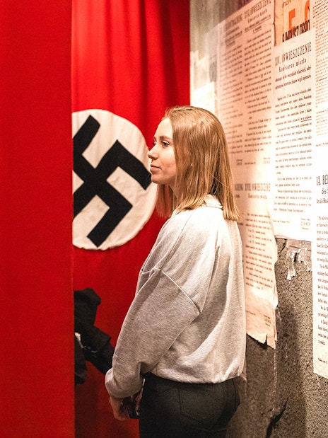 Nazi flag display inside Oskar Schindler's Factory museum exhibit.