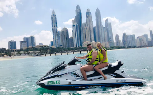 Jet ski ride with Burj Al Arab and Dubai skyline in the background.